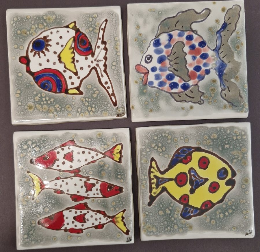 Four hand-made glazed ceramic tiles, each with a brightly patterned fish, by Ayesa Kaur